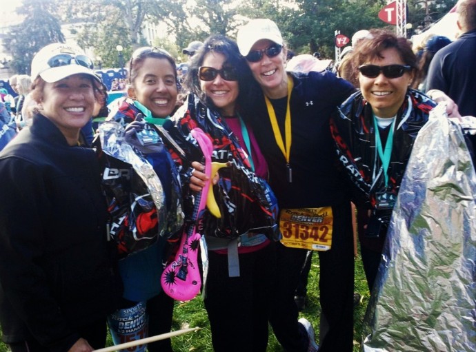 5 woman runners at the Denver Rock N Roll Half Marathon after finishing the race